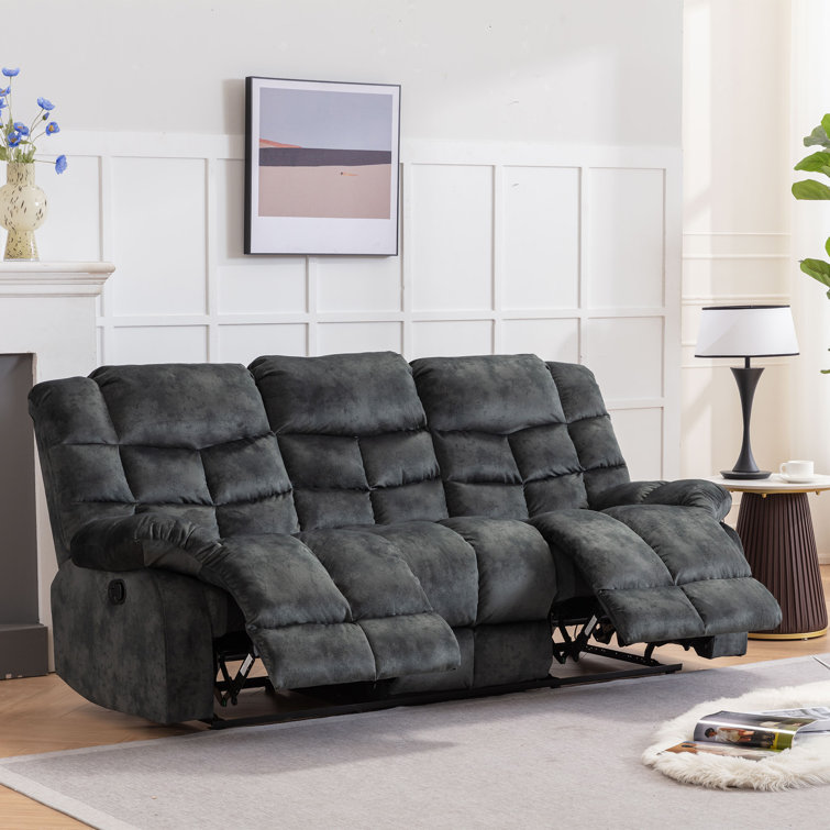 Overstuffed reclining store sofa